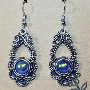Ornate silver earrings with Dragon's Eyes